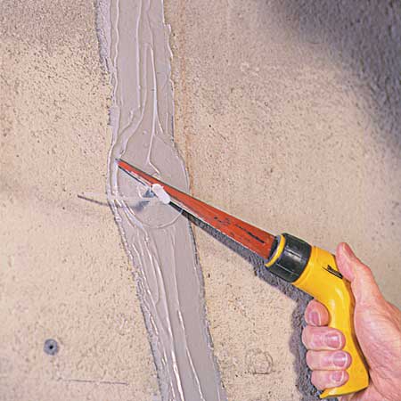 cutting away the injection port with a hacksaw