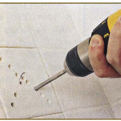 Choosing the right location and drilling holes into the tile for removal