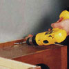 stabilize the entertainment center with a drill