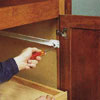 Install entertainment center hardware with screwdriver