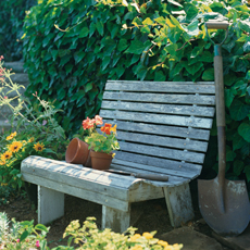 finished garden bench with garden tools