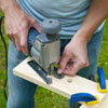 this old house editor mark powers cutting the tray handles out of a board