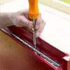 this old house editor mark powers mounting the door hardware on the pet feeding station