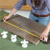 tape measure across a board to be used for mounting vintage taps as hooks