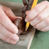 pencil marking the position where the bracket fasteners will go for this vintage porcelain tap towel rack
