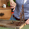 a drill used to secure the spindles to the mounting board to make a vintage porcelain tap towel rack