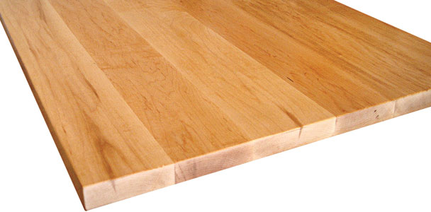 a sleek modern kitchen offset with the warm tones of a butcher-block countertop