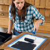 applying chalkboard paint to outside of cabinet door