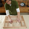 person dry fitting the cut parts together to test the parts for building dog gate