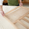 hands attaching the panel for building a dog gate