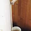 latex-gloved hand testing a TPR valve on a water heater