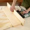 hands nailing a shelf together