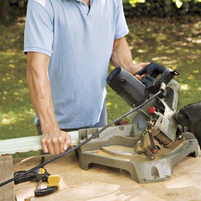 man using a miter saw
