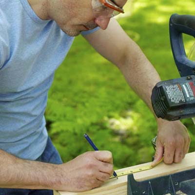 man marking kubb piece