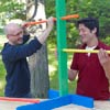two men inserting rungs for ladder golf game set