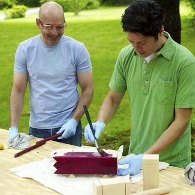 man staining pieces for kubb game