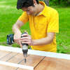 people attaching the center rail while building a ricochet game board