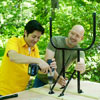 people installing the legs while building a ricochet game board