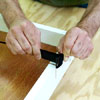 people inserting the elastic while building a ricochet game board
