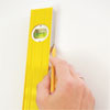 hands using a level to transfer the lines to the wall for the painted stripes