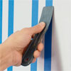 seal the tape in order to paint a striped wall