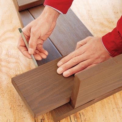 marking a cut line on board with a pencil