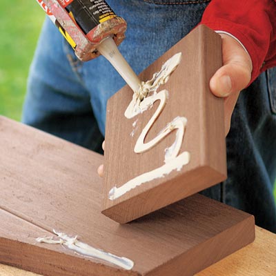 applying construction adhesive to boards