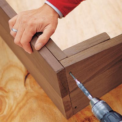 screwing the frame together with a drill/driver
