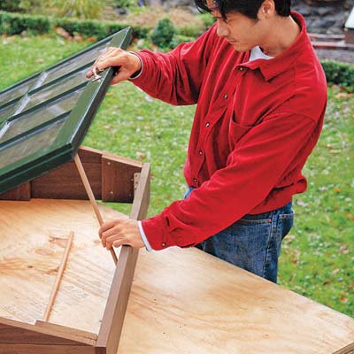 vent rod used to prop open the lid of the cold frame