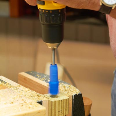 a 5/8-inch paddle bit wrapped with painter's tape as a depth marker