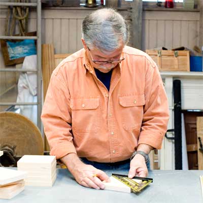 this old house general contractor marking hole locations for the spacers while building a freestanding lamp