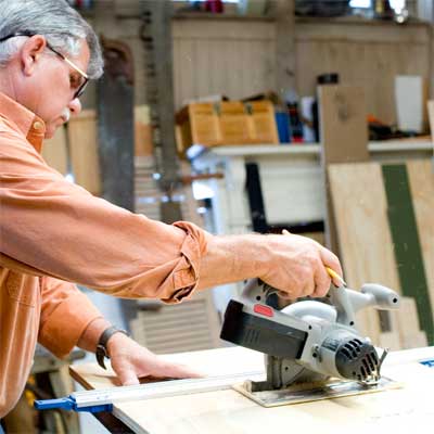 this old house general contractor cutting the base and feet while building a freestanding lamp