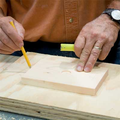 this old house general contractor attaching the ledge to the base and feet while building a freestanding lamp