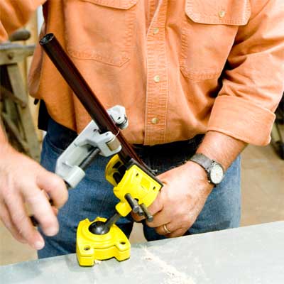 this old house general contractor cutting the spacess while building a freestanding lamp
