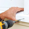 man attaching new windowsill