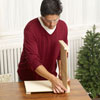 Mark Powers putting together two sides of the x-mas tree box stand