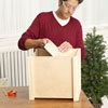 Mark Powers attaches the bottom of the x-mas tree box stand