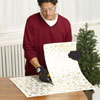 Mark Powers cuts squares of tin ceiling for the sides of the x-mas tree box stand