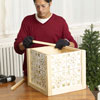 Mark Powers adds interior support strips of the x-mas tree box stand