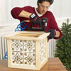 Mark Powers attaches the frame for the top of the x-mas tree box stand