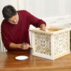 Mark Powers paints the trim of the x-mas tree box stand