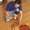 tapping the medallion flush with the rest of the floor with a rubber mallet and a piece of scrap wood to prevent scratches
