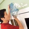 Mark Powers peels away the top stencil 