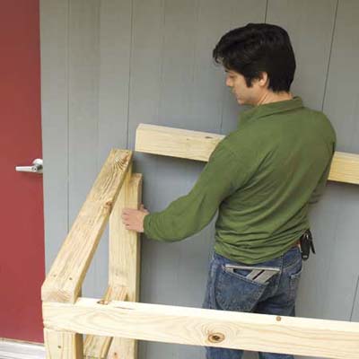 Mark Powers installing the back crosspiece for his trash shed