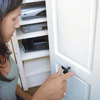 inserting the knob post after predrilling a hole centered on the shutter