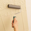 using a smoothing roller to the Lincrusta wainscot panel to minimize air bubbles