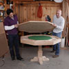 men assembling poker table