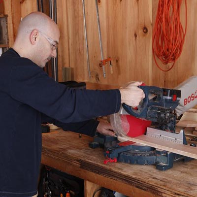 cutting the 1x4 boards with a miter saw