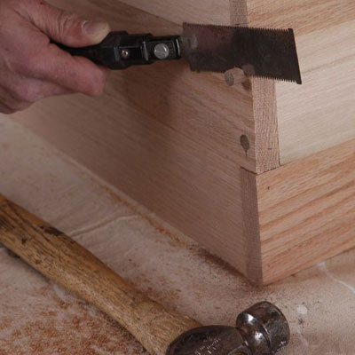 cutting the dowels with a flush-cut saw
