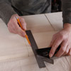 marking notches in the wine-rack insert with a combination square and pencil